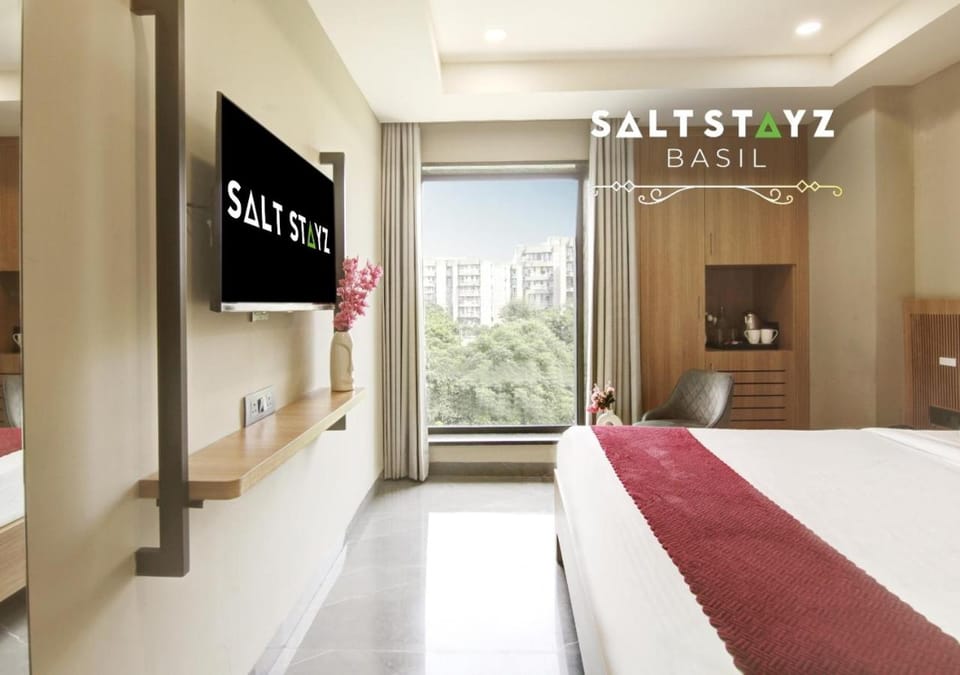 Bed, Property logo or sign, TV and multimedia, Coffee/tea facilities, Photo of the whole room, Bedroom, Text overlay, wardrobe, air conditioner