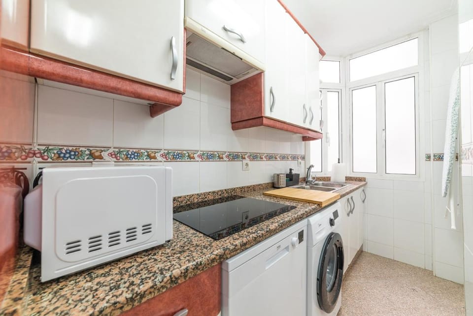 Kitchen or kitchenette, dishwasher, stove, washing machine