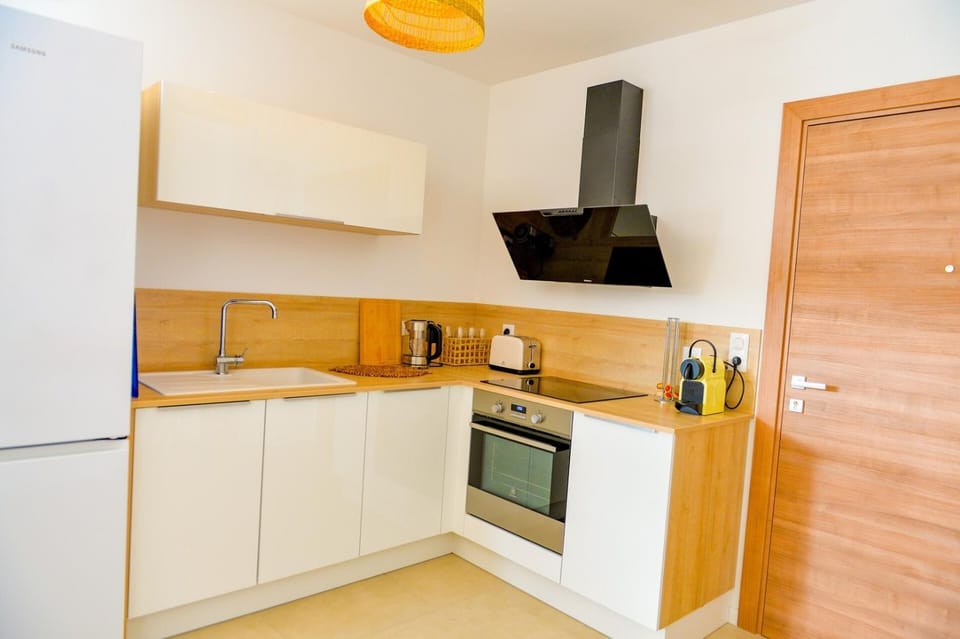 Kitchen or kitchenette, oven, stove
