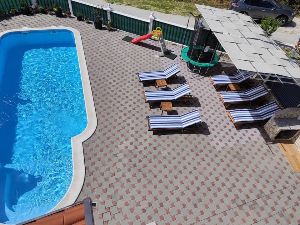 Patio, Day, Natural landscape, Pool view, Swimming pool, sunbed