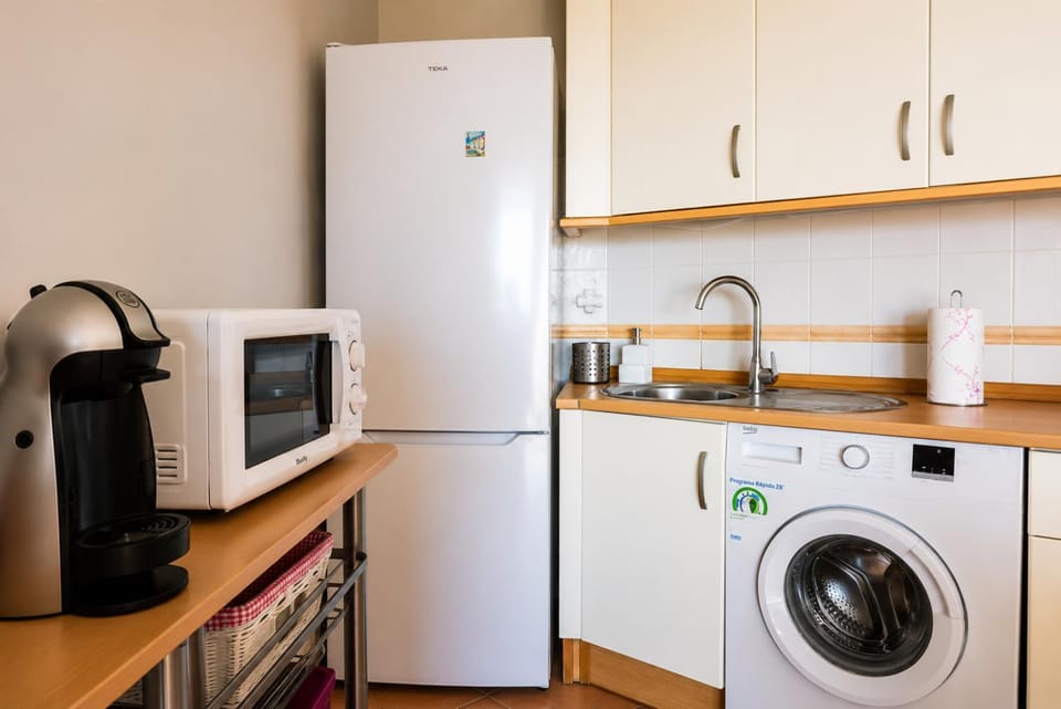 Kitchen or kitchenette, washing machine