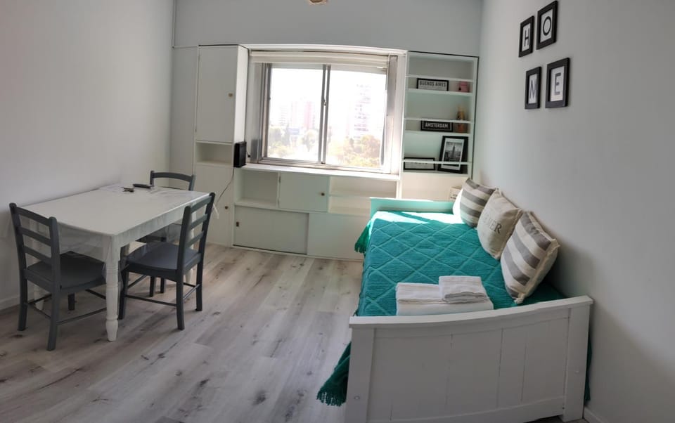 Bed, Living room, Seating area, Dining area
