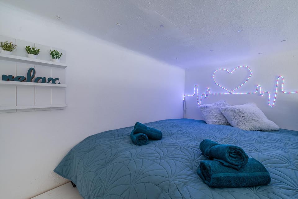 Bed, Decorative detail, Bedroom, locker, towels, air conditioner