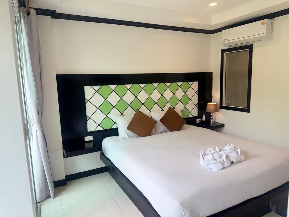 Bed, Photo of the whole room, Bedroom, towels, air conditioner