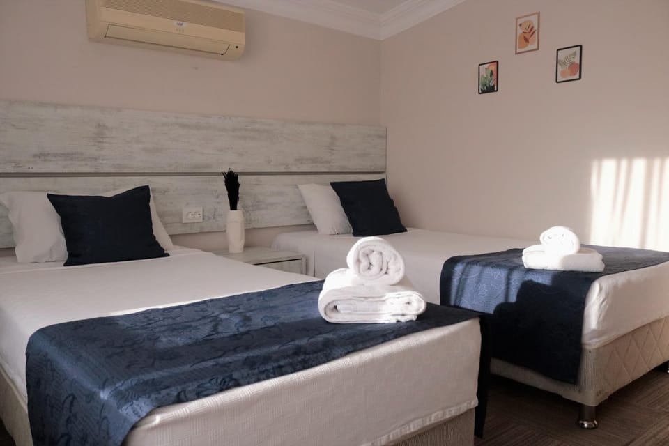 Bed, towels, air conditioner