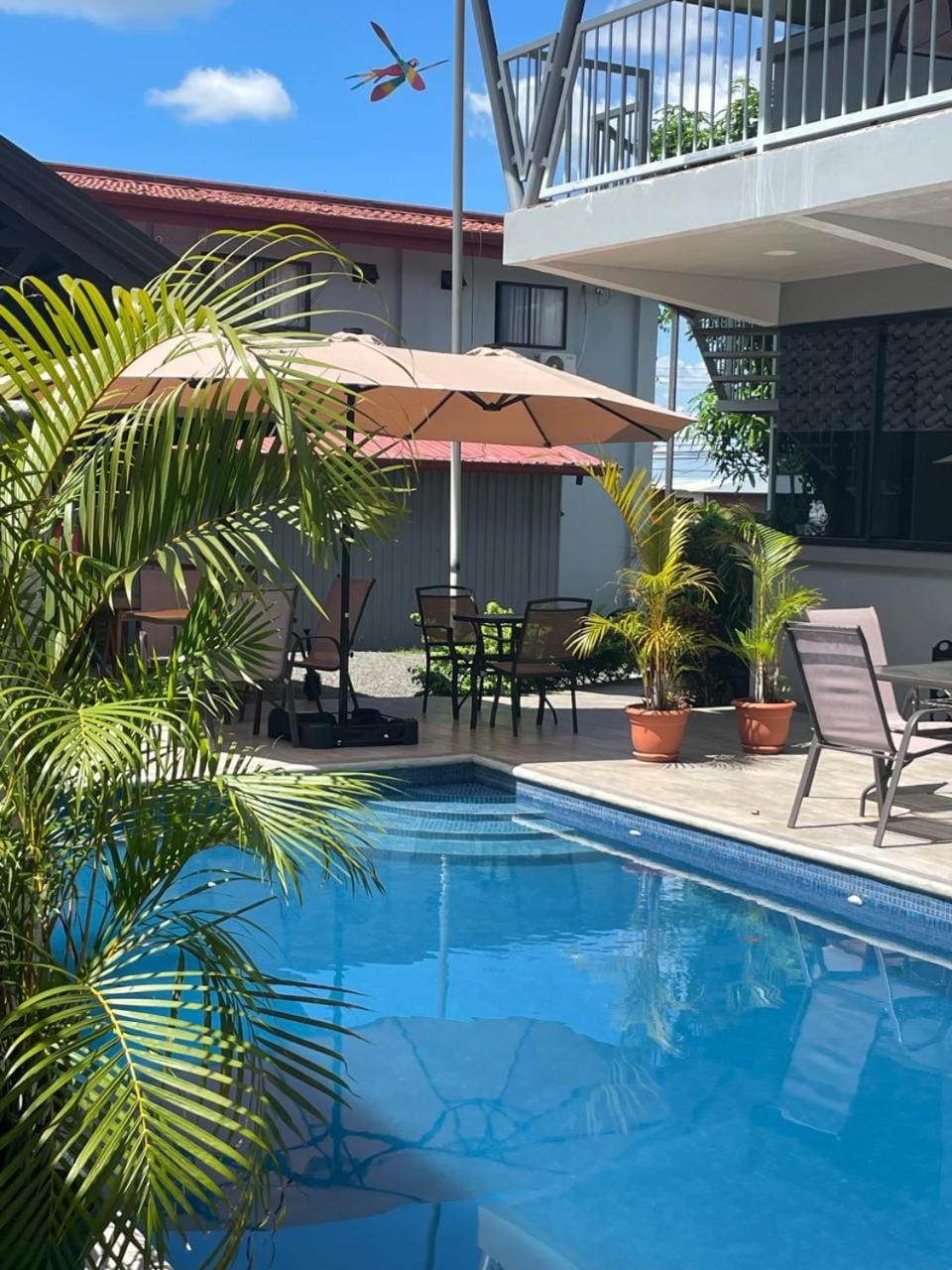 Property building, Patio, Communal lounge/ TV room, Day, Garden, Lounge or bar, Garden view, Pool view, Swimming pool, sunbed