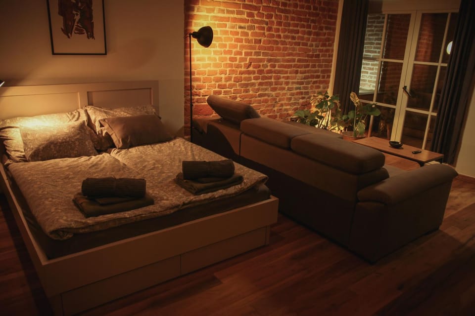 Bed, Living room, Seating area, Bedroom