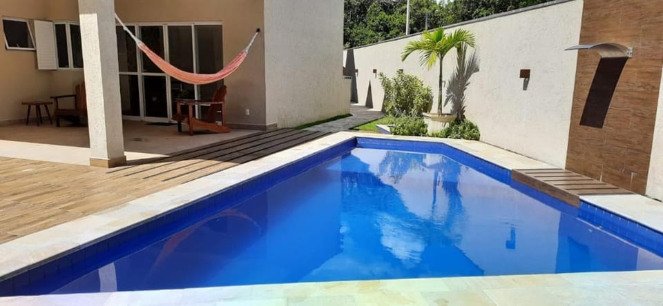 CASA TERREA WI-FI 3 SUITES 900m PRAIA DE GUARATUBA SP House in Bertioga