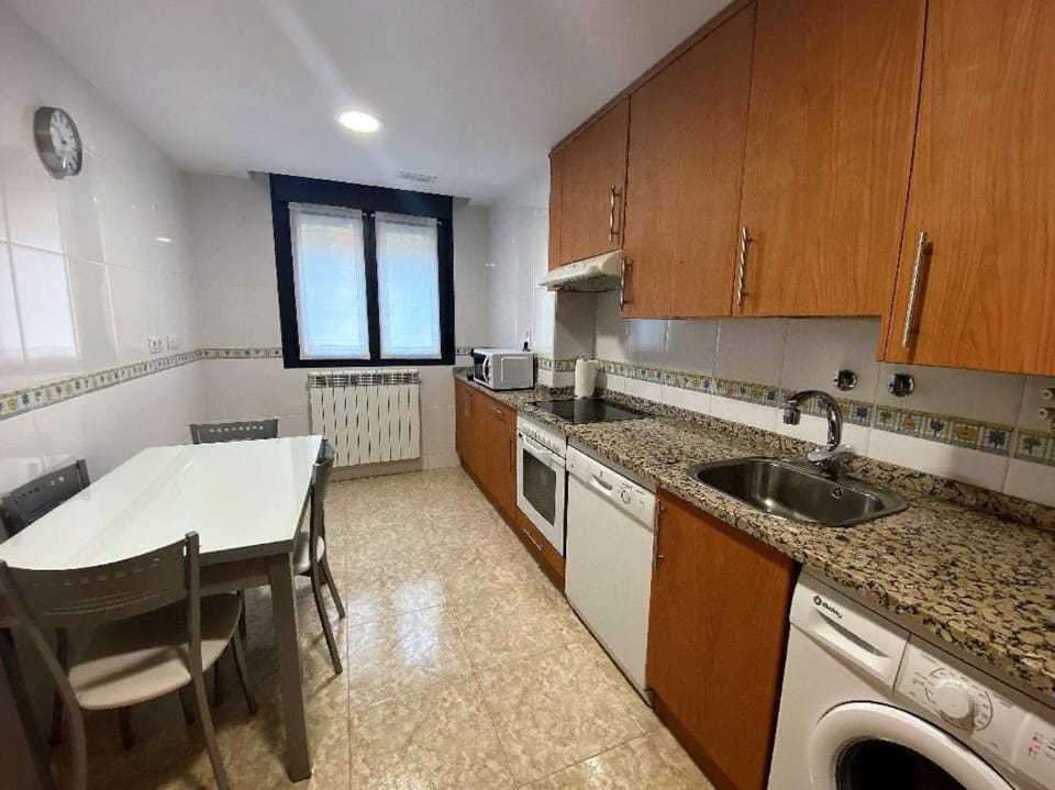 Kitchen or kitchenette, dishwasher, oven, stove, washing machine