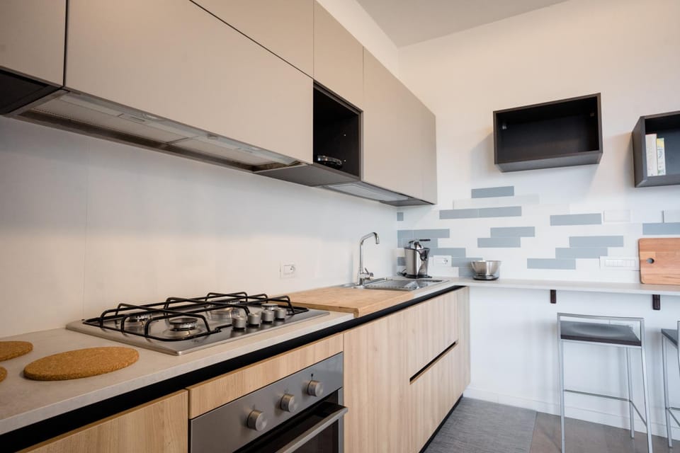Kitchen or kitchenette, dishwasher, stove, toaster