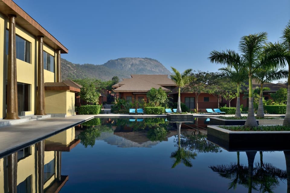 Property building, Nearby landmark, Facade/entrance, Natural landscape, Mountain view, Pool view, Swimming pool