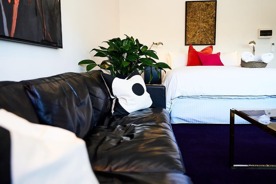 Bed, Living room, Seating area, Bedroom