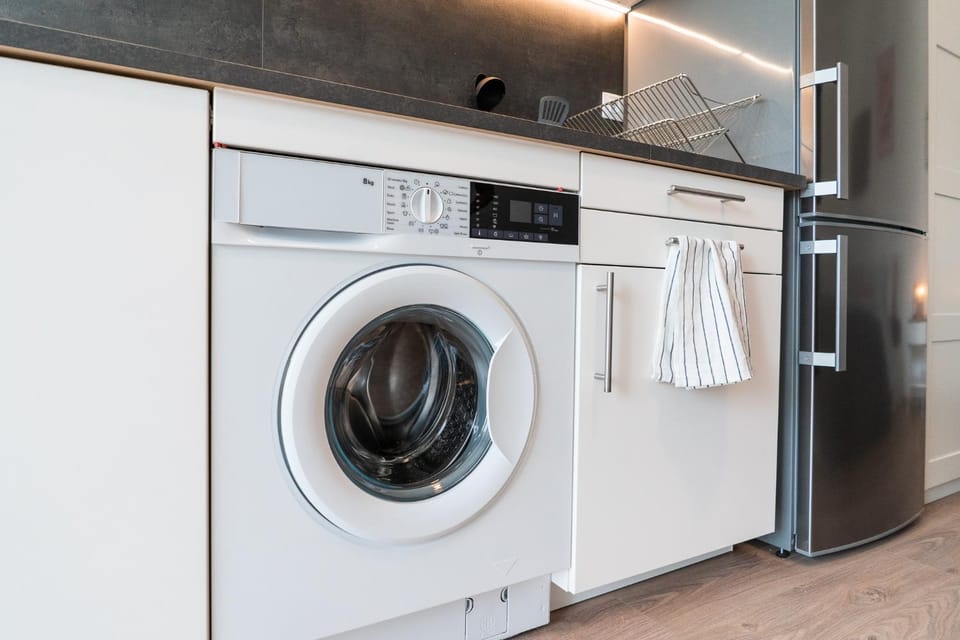 Kitchen or kitchenette, washing machine