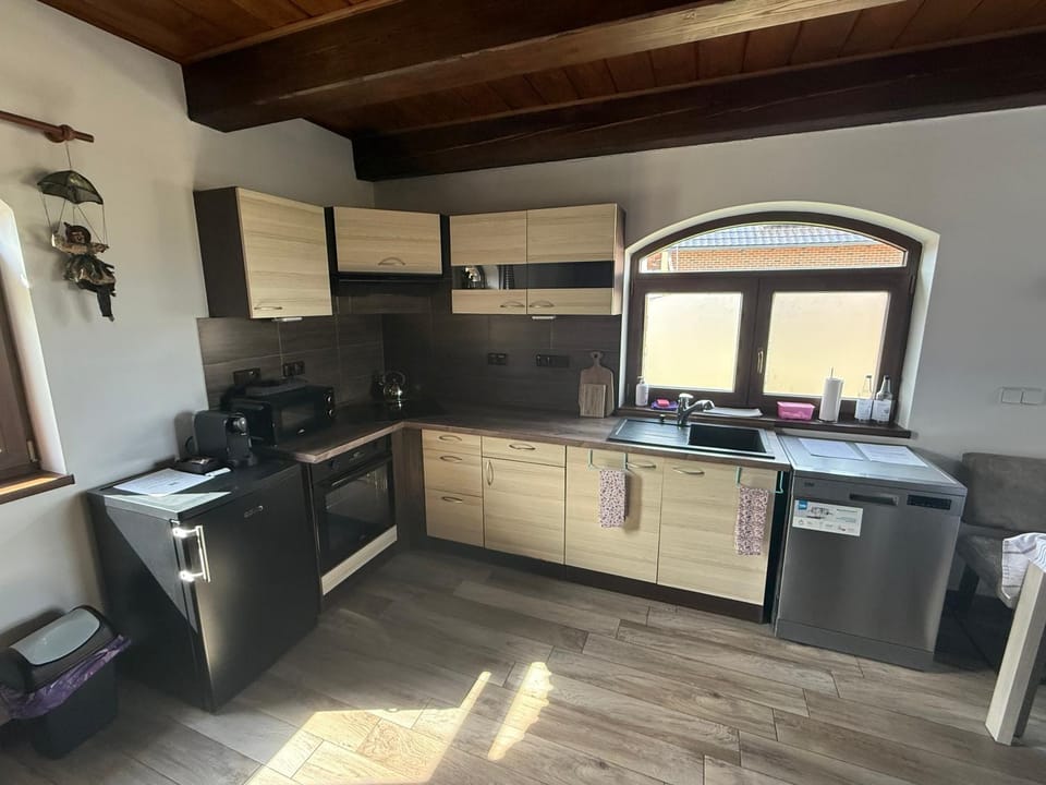 Kitchen or kitchenette, dishwasher, oven, stove