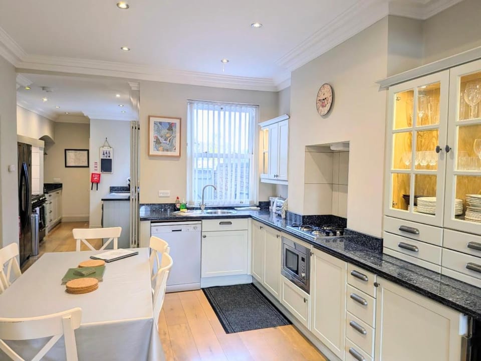 Kitchen or kitchenette, Dining area, dishwasher, oven, stove, toaster