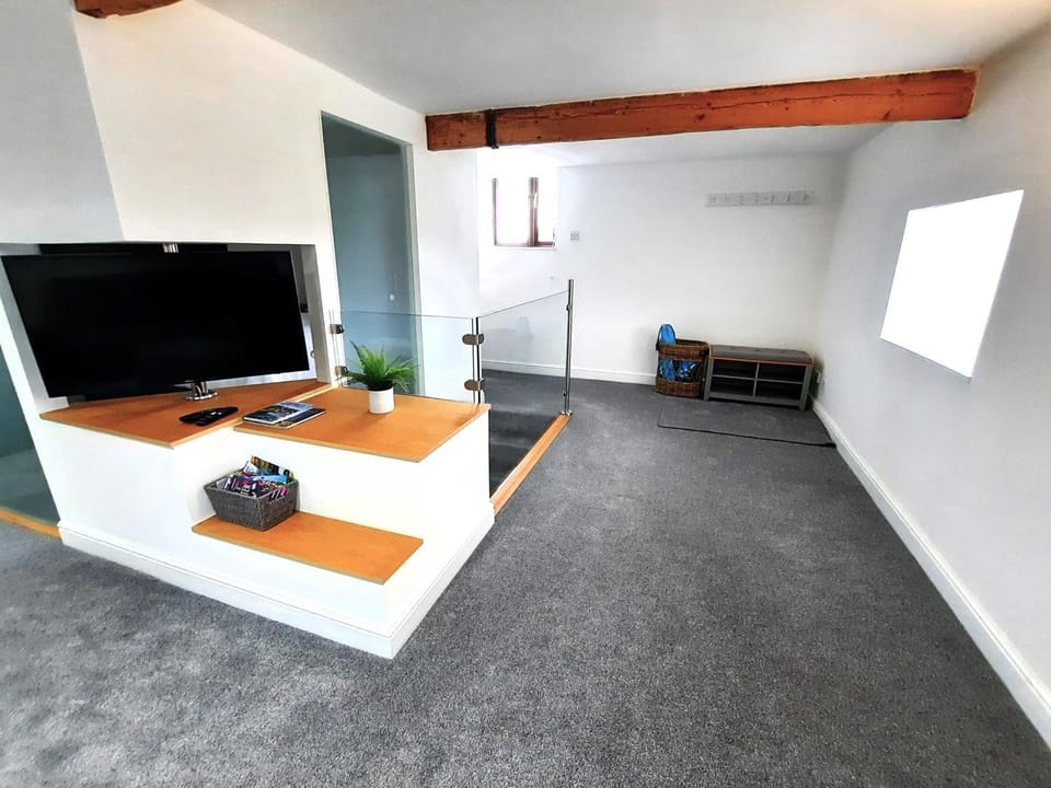 The Penthouse, top floor of a Grade II Listed Mill Apartment in England
