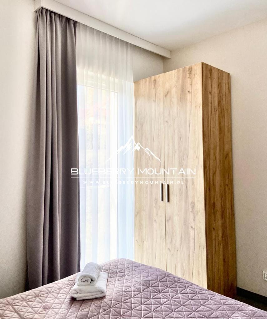 Bed, towels, wardrobe