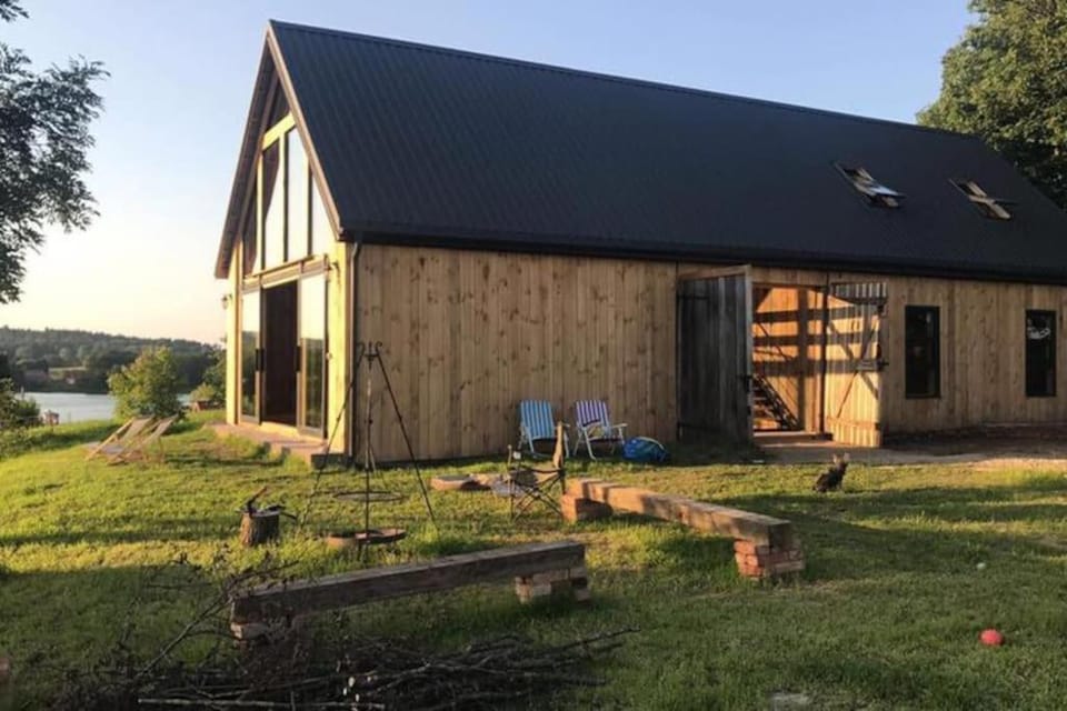 Modern Barn Home & Sauna by the lake, przytulnastodola, Stodoła nad jeziorem na Mazurach House in Poland