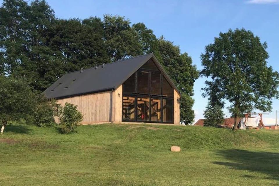 Modern Barn Home & Sauna by the lake, przytulnastodola, Stodoła nad jeziorem na Mazurach House in Poland