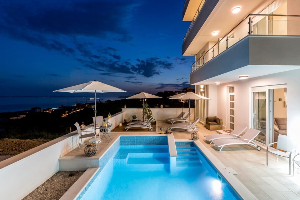 Property building, Night, View (from property/room), Pool view, Swimming pool, sunbed