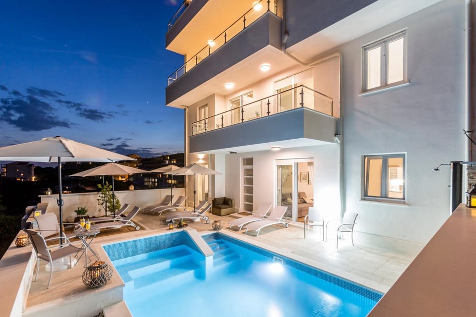 Property building, Night, Pool view, Swimming pool, sunbed