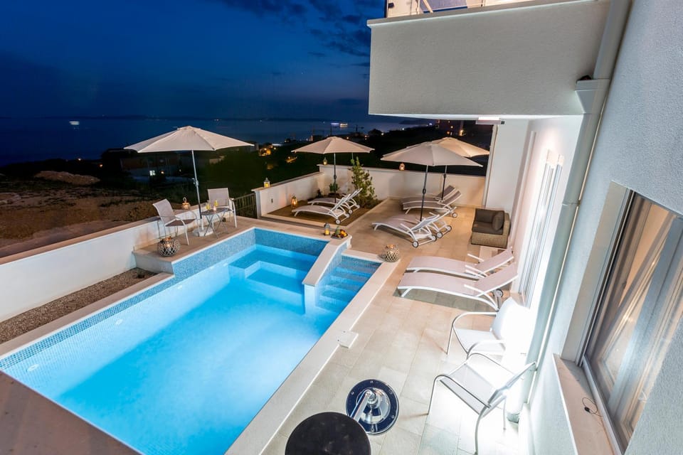 Property building, Night, Pool view, Swimming pool, sunbed