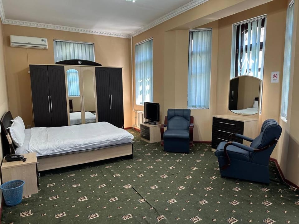 Bed, Seating area, Bedroom, hair dresser, wardrobe, air conditioner