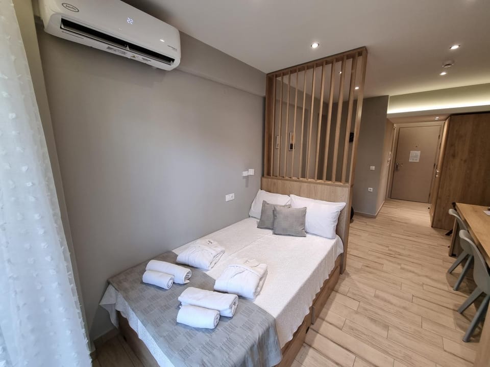Bed, Photo of the whole room, Bedroom, towels, air conditioner