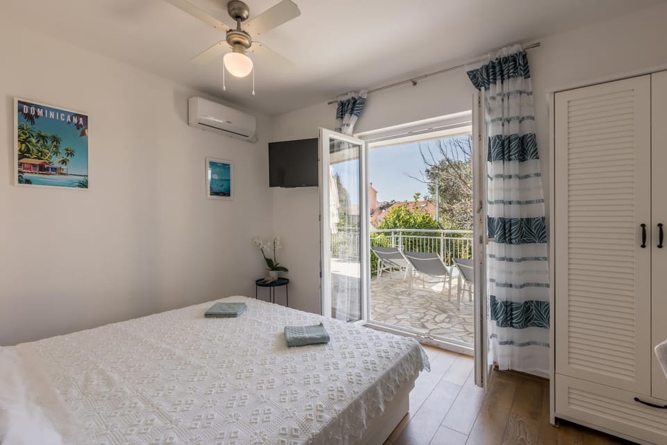 Bed, Bedroom, fireplace, towels, wardrobe, air conditioner