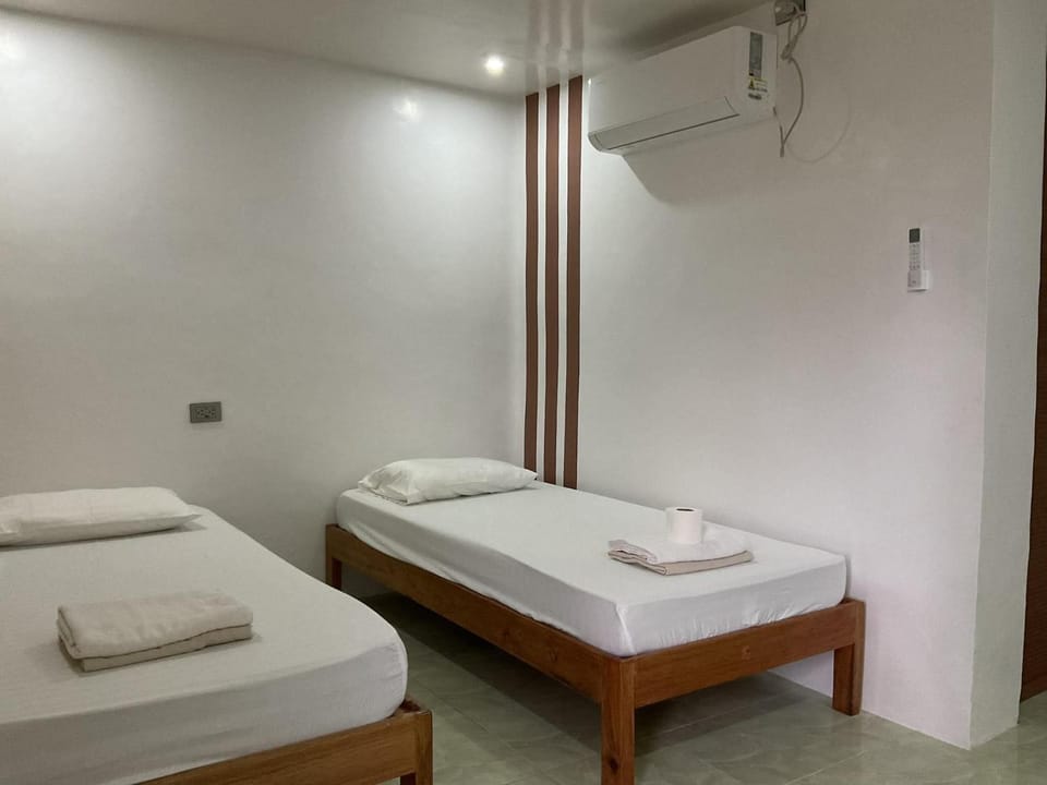 Bed, Photo of the whole room, Bedroom, towels, air conditioner