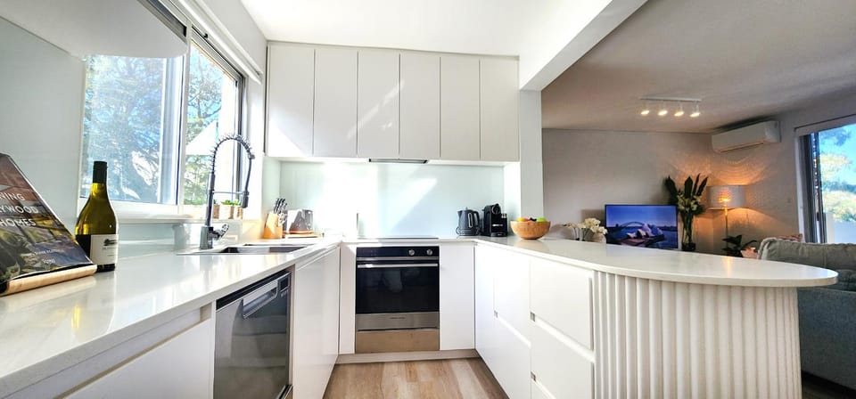 Kitchen or kitchenette, dishwasher, oven, stove