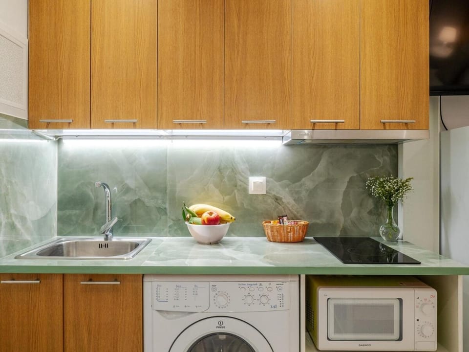 Kitchen or kitchenette, stove, washing machine