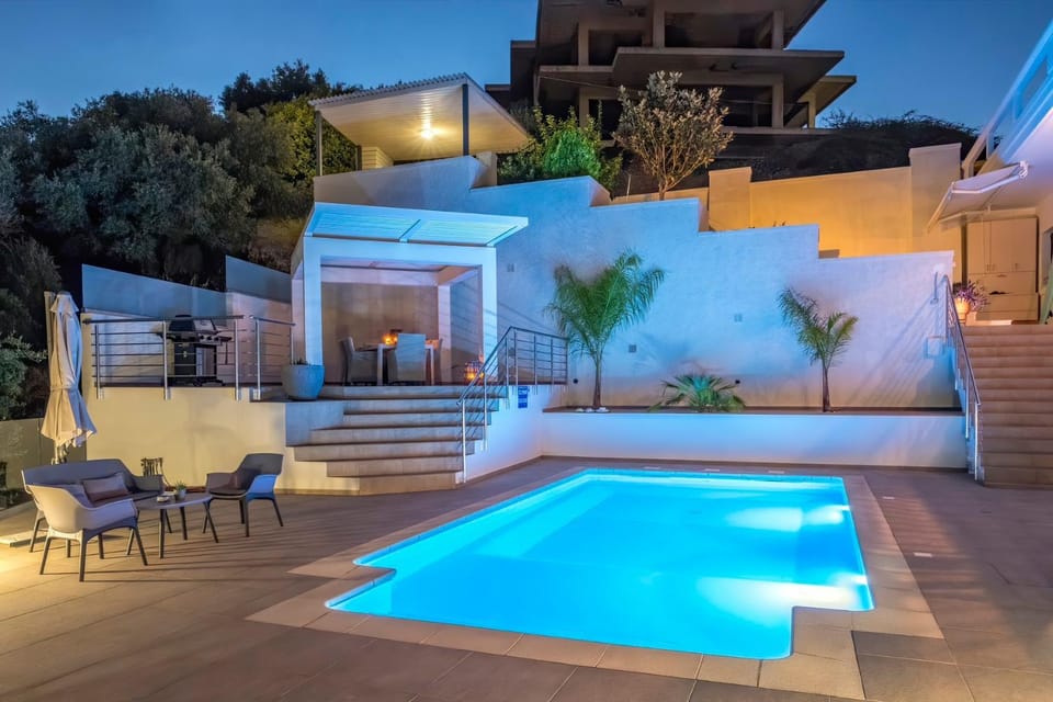 Property building, Night, Natural landscape, View (from property/room), Swimming pool