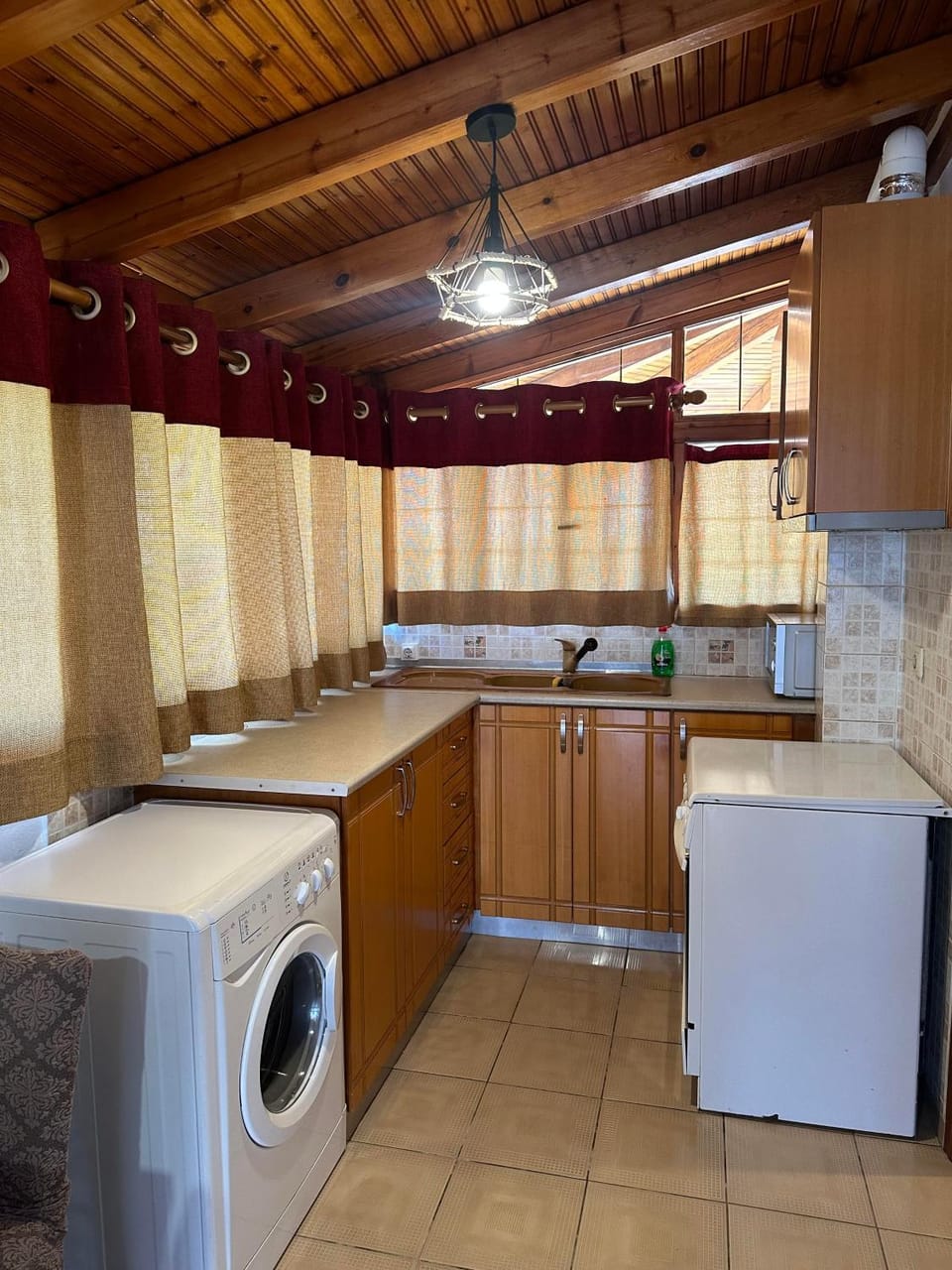 Kitchen or kitchenette, stove, washing machine