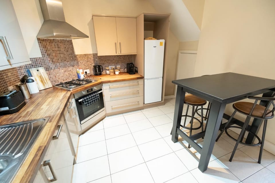 Dining area, dishwasher, oven, toaster, kitchen