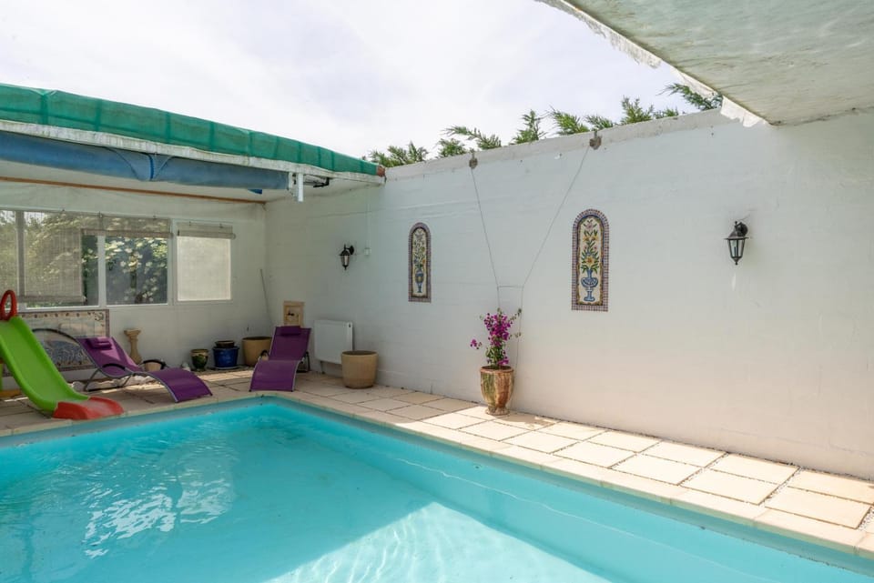 Property building, Living room, Swimming pool