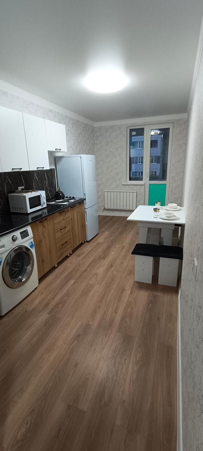 Kitchen or kitchenette, minibar, stove, washing machine, dryer