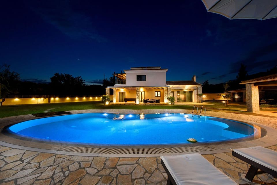 Property building, Patio, Night, Pool view, Swimming pool, sunbed