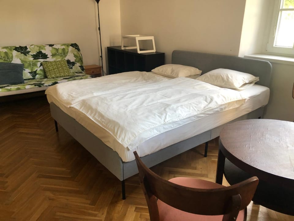 Property building, Bed, Seating area, Bedroom