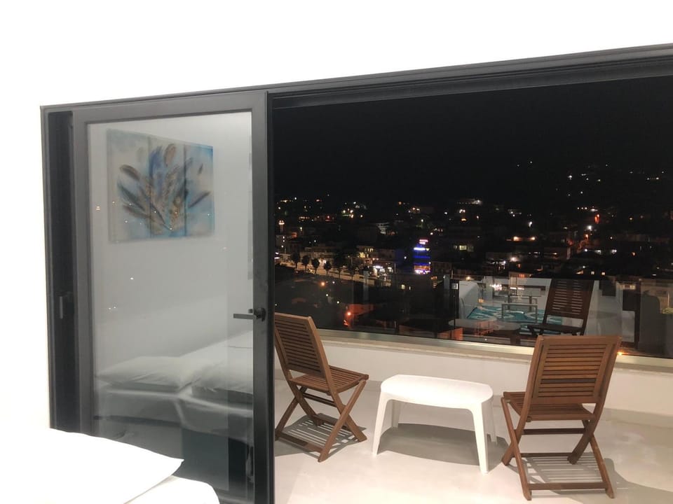 Night, View (from property/room), Balcony/Terrace, Living room, Seating area, City view