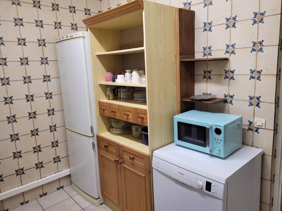 Kitchen or kitchenette, dishwasher, microwave, oven, pet friendly, storage, stove, washing machine