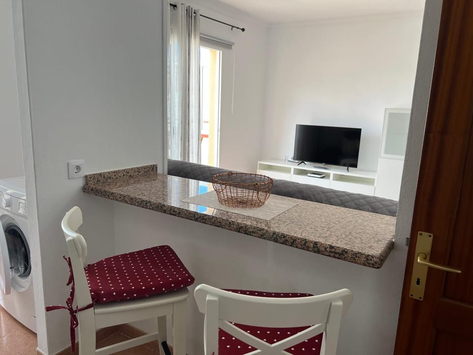 Kitchen or kitchenette, washing machine