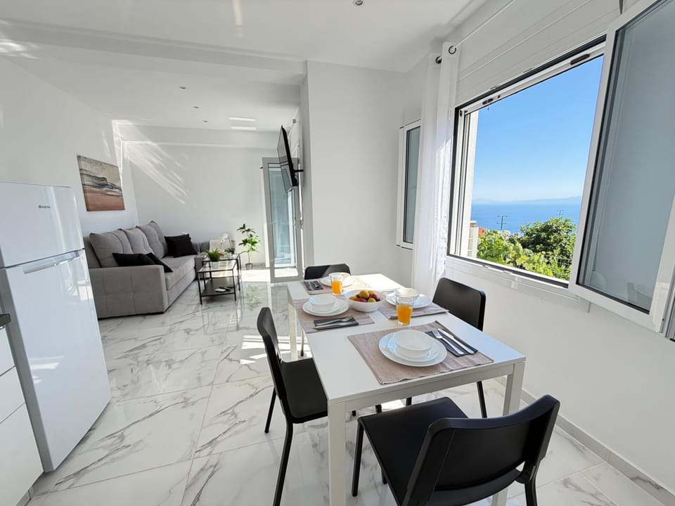 Natural landscape, View (from property/room), Living room, Seating area, Dining area, Sea view