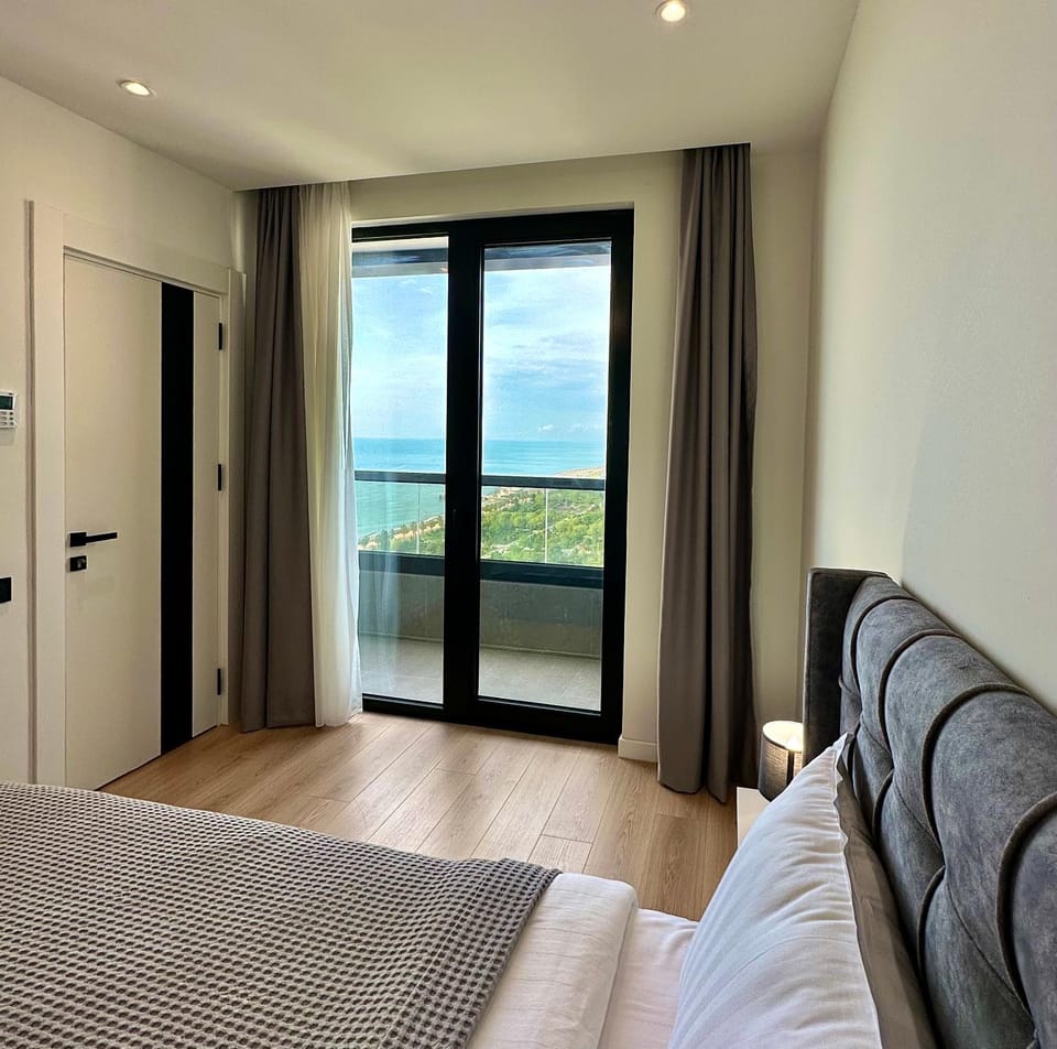 Bed, Natural landscape, Living room, Seating area, Bedroom, Sea view