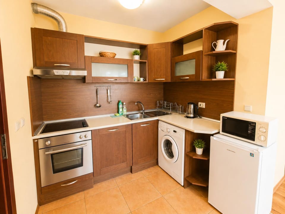 Kitchen or kitchenette, stove, washing machine