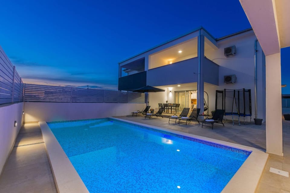 Patio, Night, Pool view, Swimming pool, sunbed