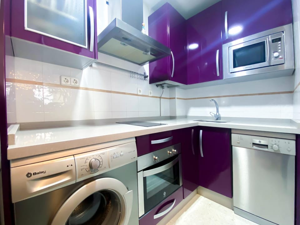 Kitchen or kitchenette, dishwasher, oven, stove, washing machine
