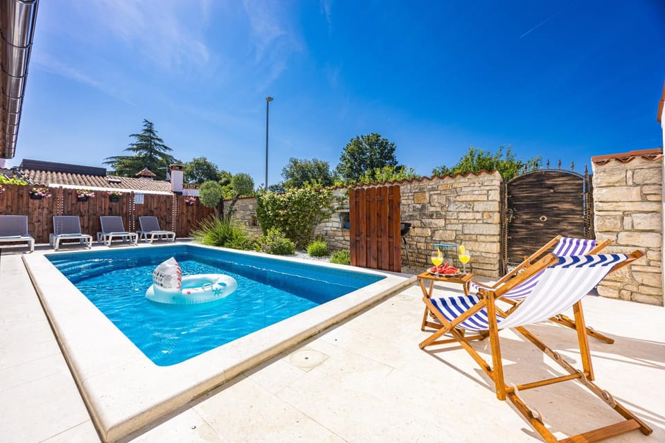Patio, Day, Natural landscape, Pool view, Swimming pool, sunbed