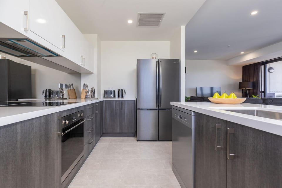 Kitchen or kitchenette, dishwasher, oven, stove
