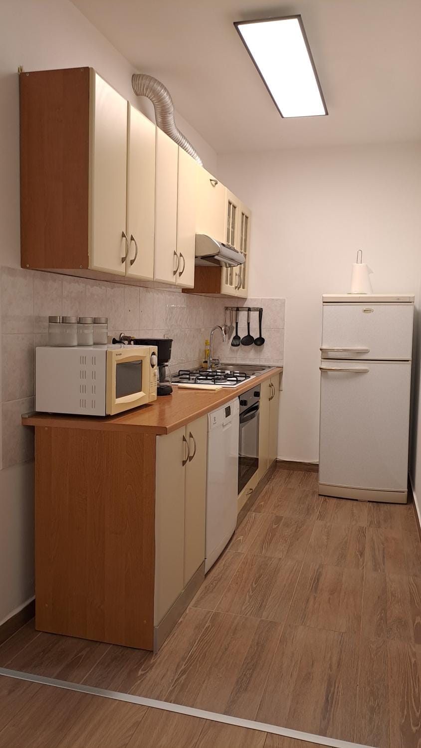Kitchen or kitchenette, dishwasher, microwave, oven, stove